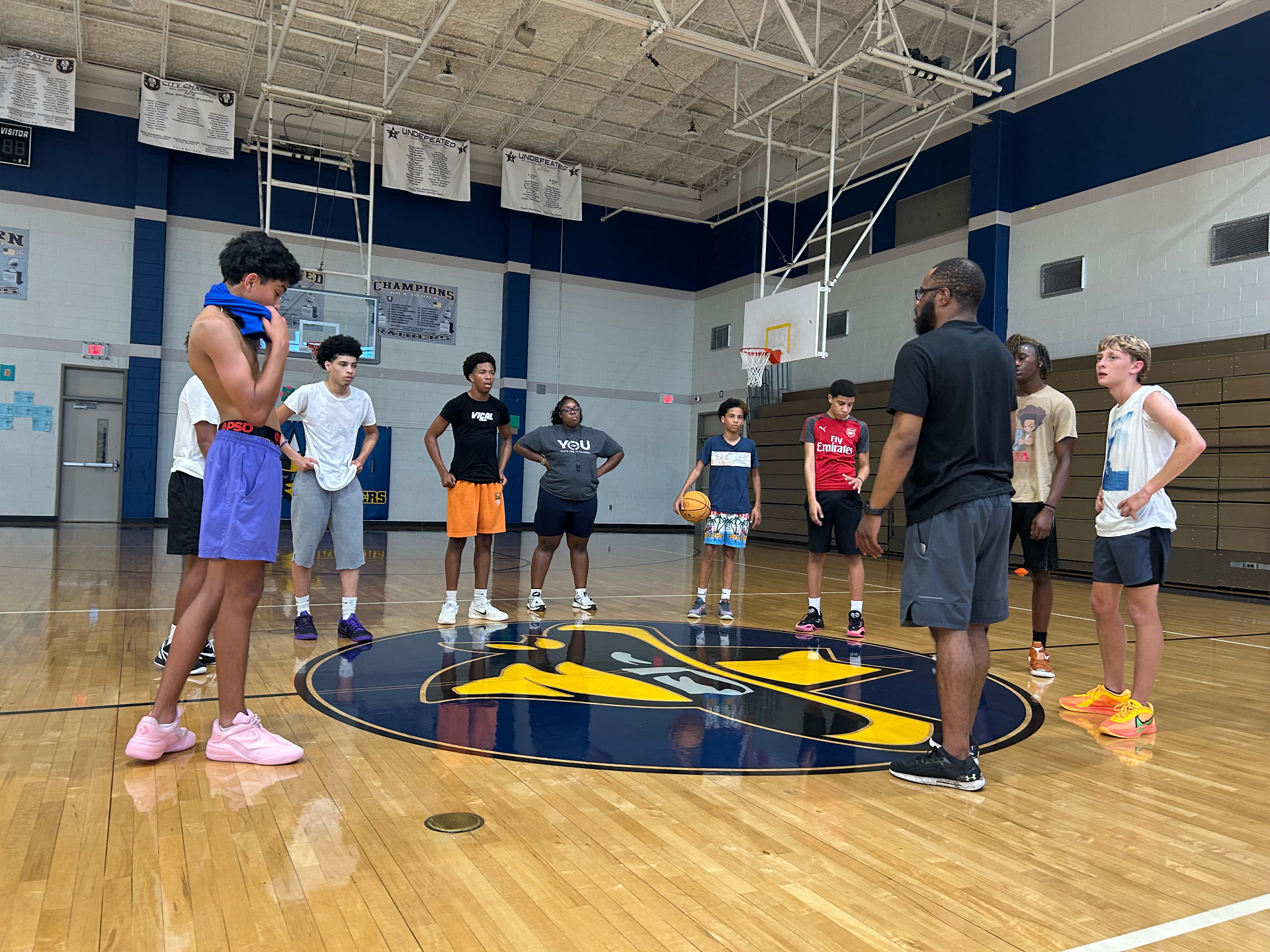 BCS Hawks players listening during indoor skill training at Sam Rayburn